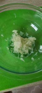 grated onion in bowl
